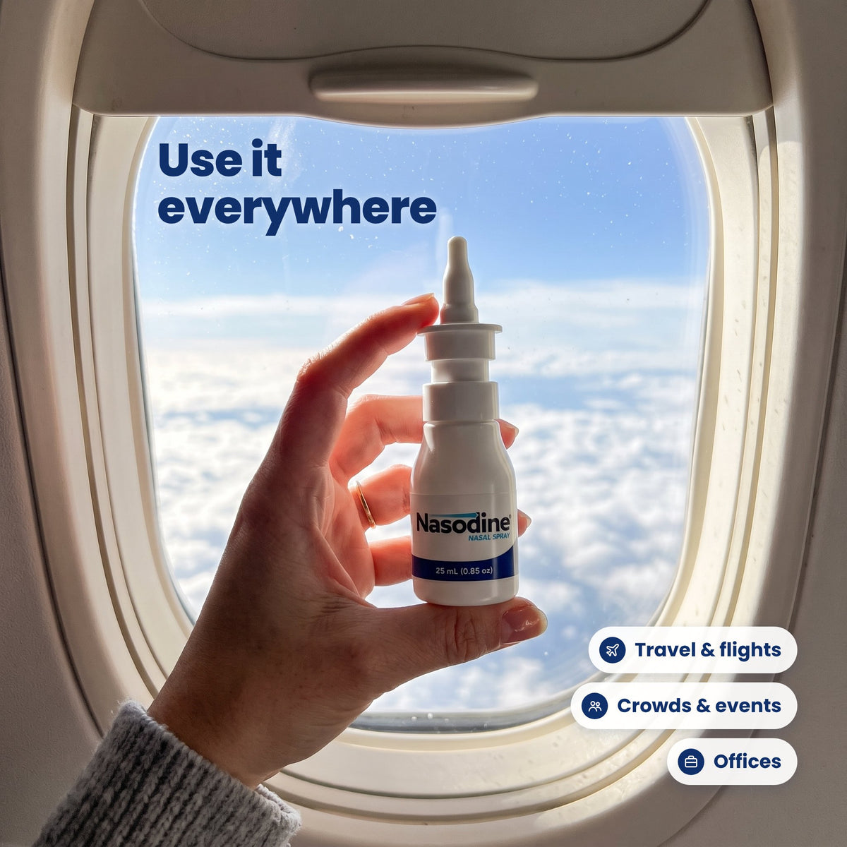Nasodine bottle held by an airplane window: use it for travel, crowds and offices